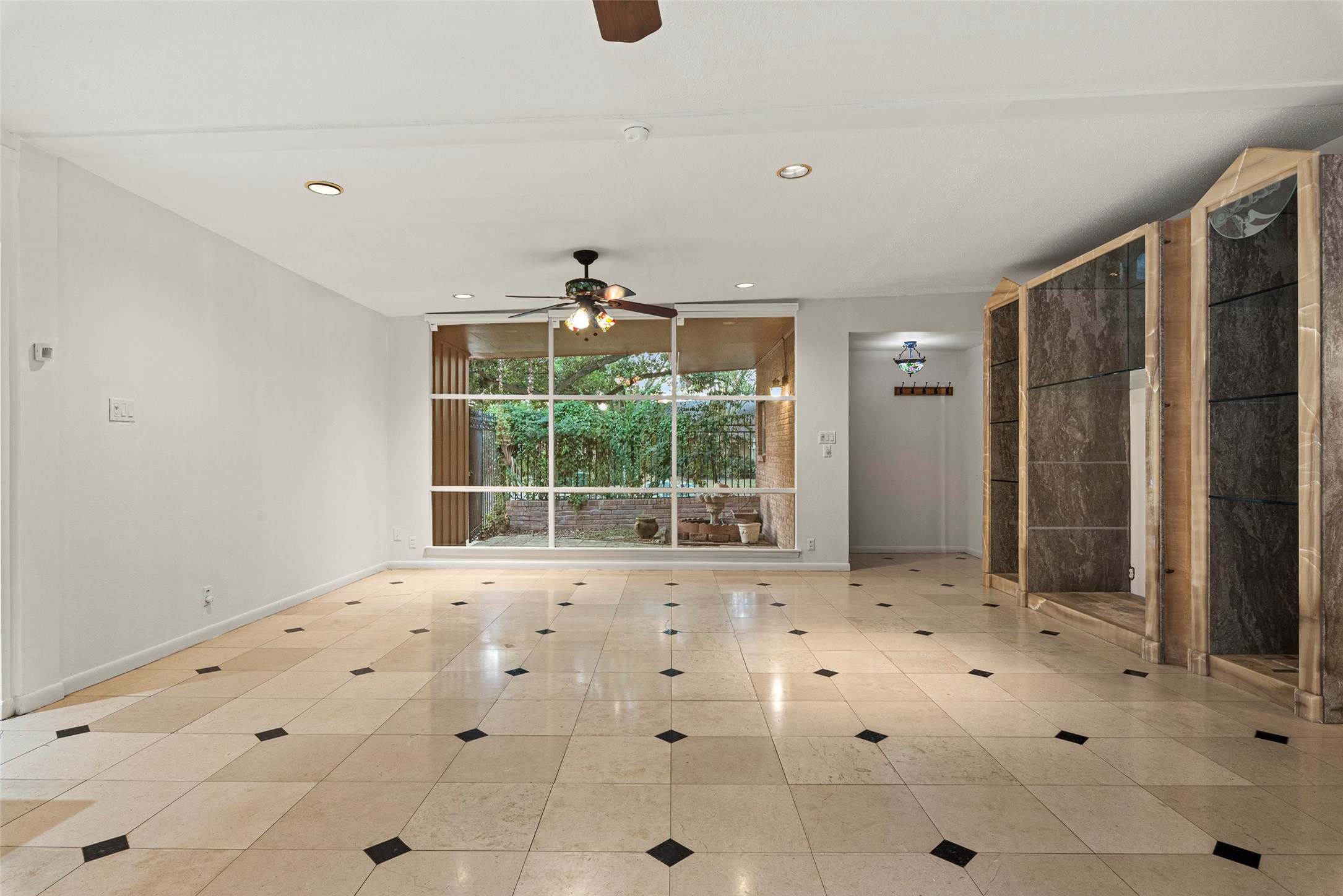 2927 Rockyridge Drive Houston, TX 77063 - Photo 8 of 34 a view of an empty room with a window