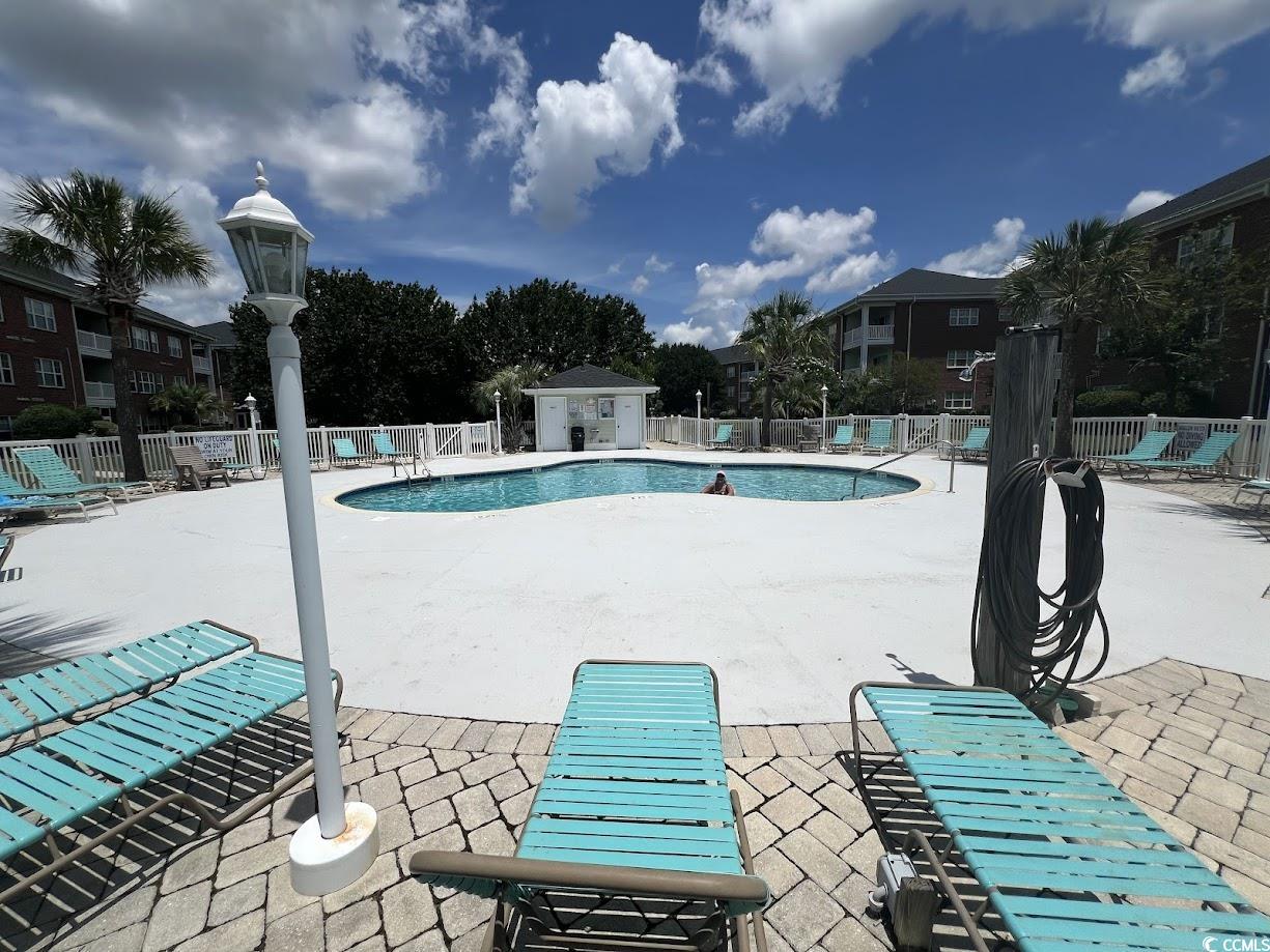 3965 Forsythia Court, Unit 202 Myrtle Beach, SC 29588 - Photo 11 of 15 Community pool featuring a patio area