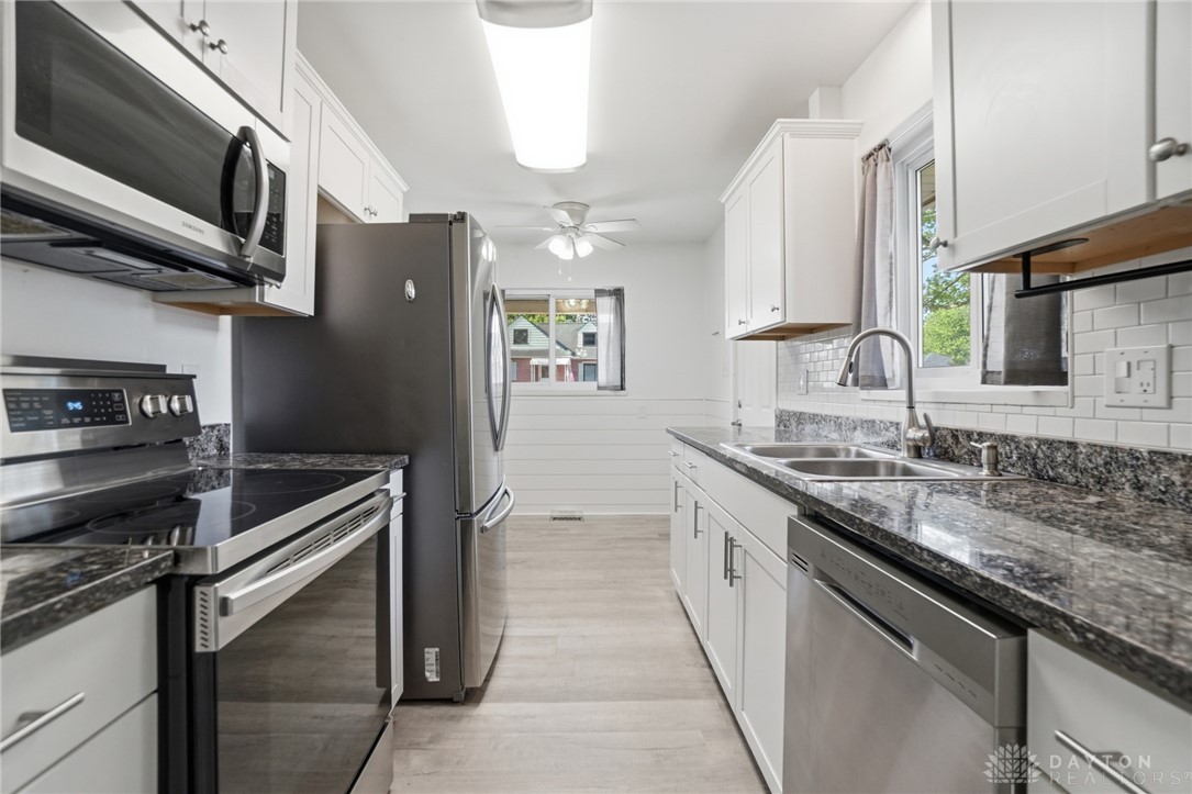 629 Storms Road Dayton, OH 45429 - Photo 20 of 51 This bright kitchen features sleek appliances and ample counter space, perfect for culinary endeavors.