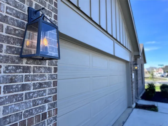 a kitchen with stainless steel appliances kitchen island granite countertop a stove a sink a refrigerator and a microwave