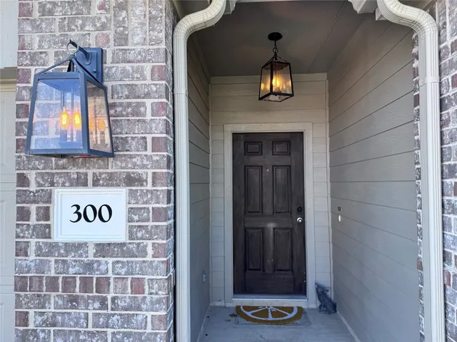 a view of a kitchen with a sink dishwasher and a fireplace