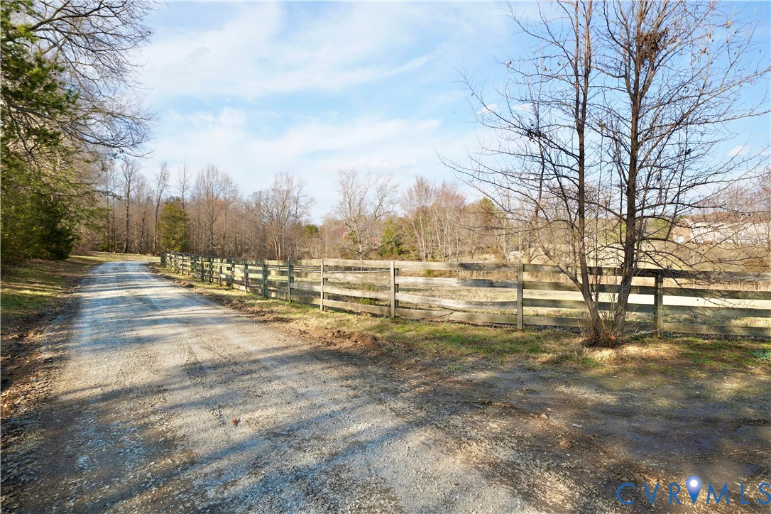 805 Rockford Road Manakin-Sabot, VA 23103 - Photo 3 of 46 a view of a yard with trees in the background