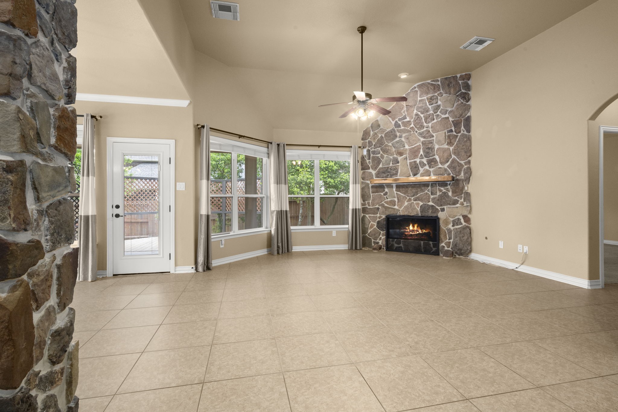 110 David Forest Lane Conroe, TX 77384 - Photo 21 of 35 a view of empty room with fireplace and chandelier