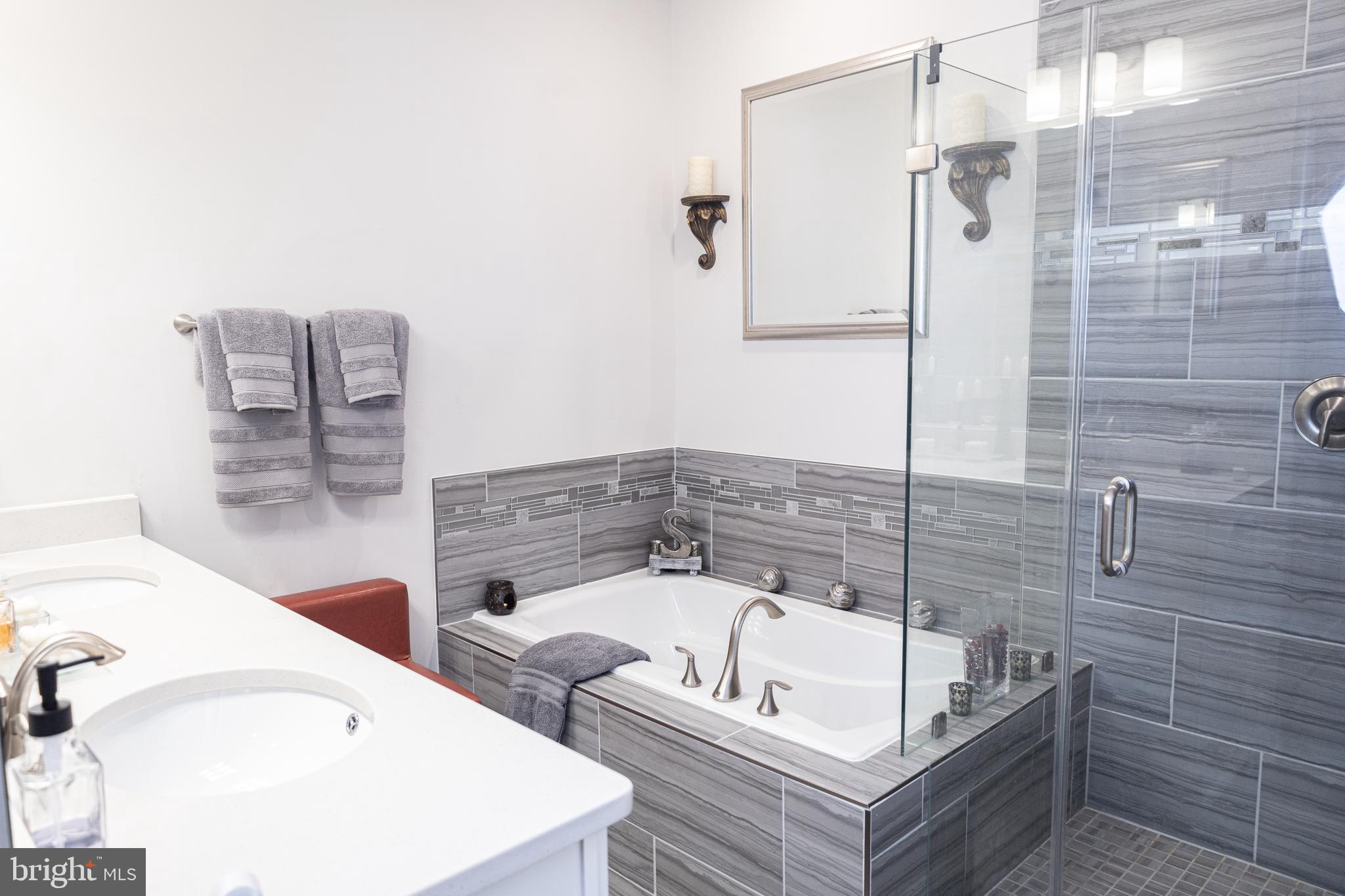 12207 American Chestnut Road Bowie, MD 20720 - Photo 12 of 19 a bathroom with a bathtub and shower