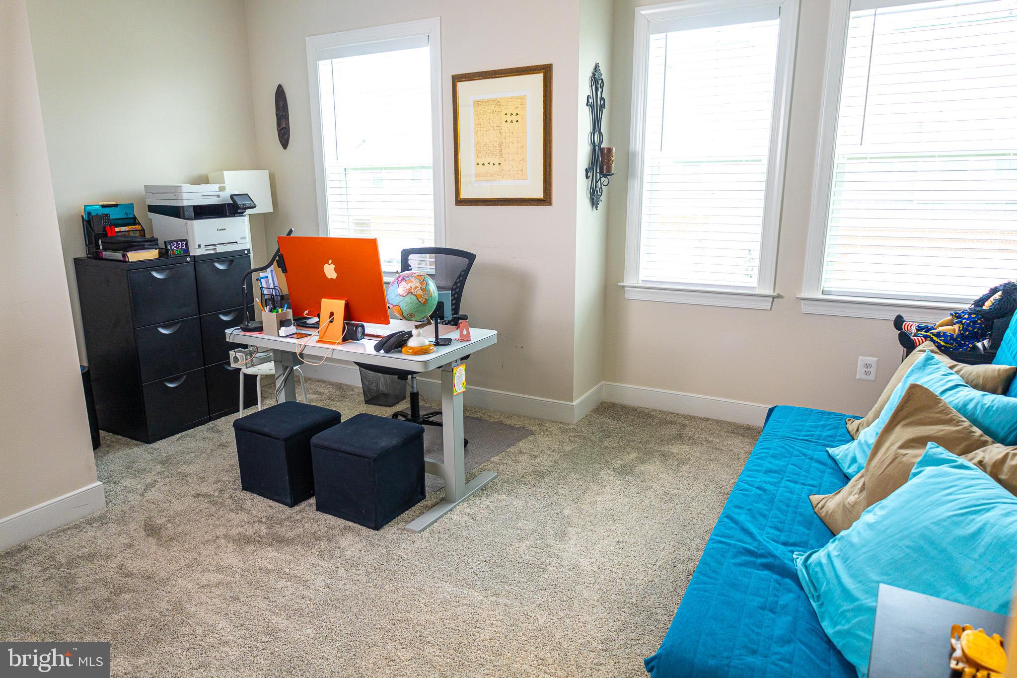 12207 American Chestnut Road Bowie, MD 20720 - Photo 17 of 19 a room with furniture and a window