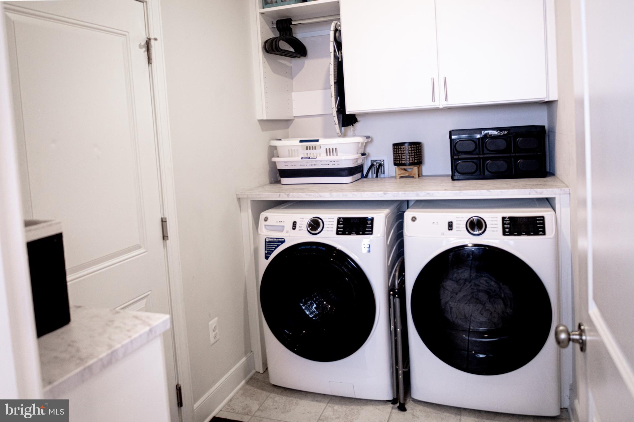 12207 American Chestnut Road Bowie, MD 20720 - Photo 18 of 19 a kitchen with a washer and dryer