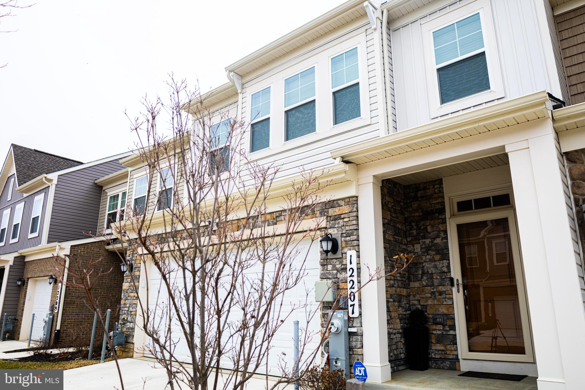 12207 American Chestnut Road Bowie, MD 20720 - Photo 2 of 19 a view of a building with a street