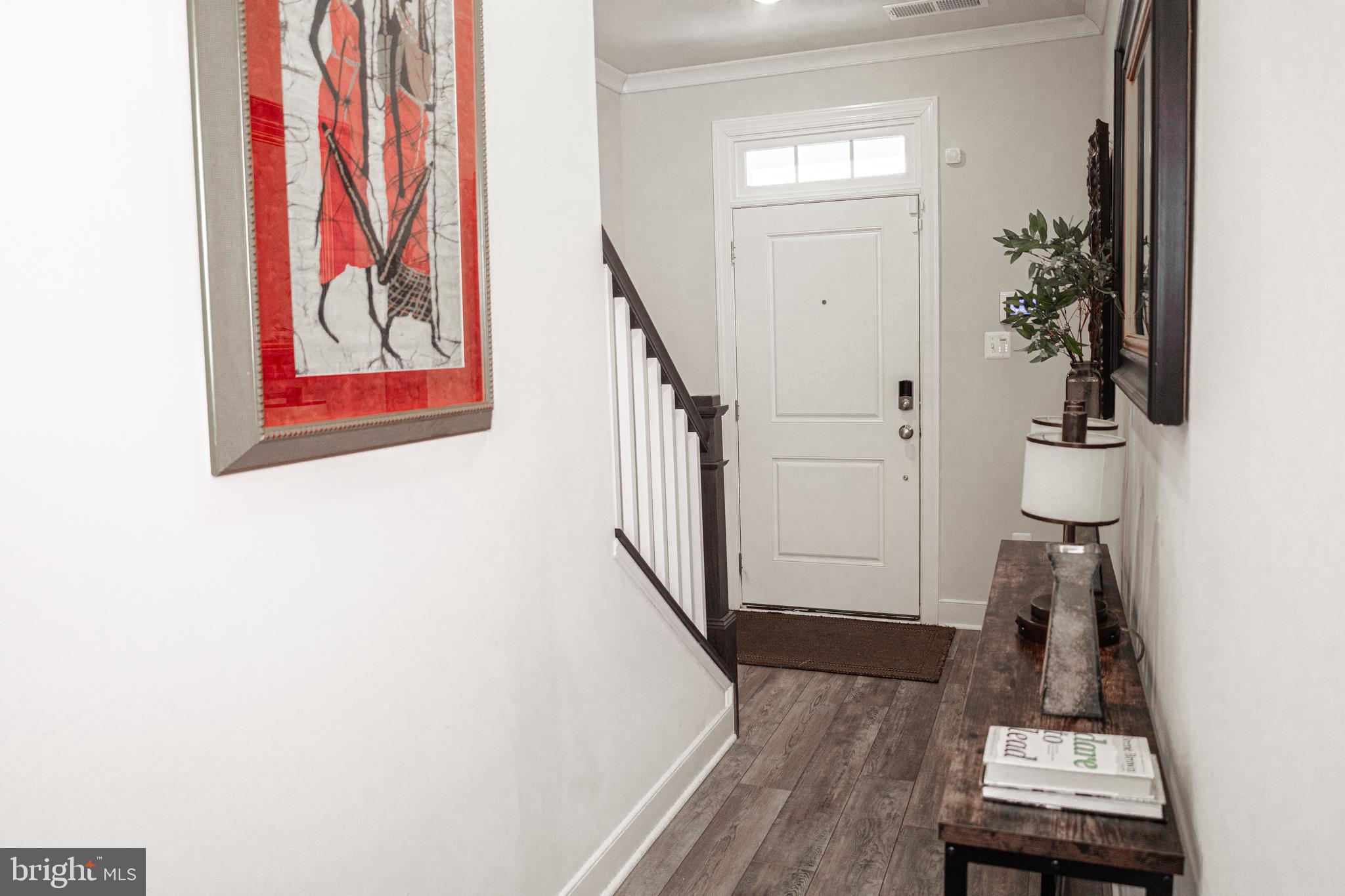 12207 American Chestnut Road Bowie, MD 20720 - Photo 4 of 19 a view of entryway with wooden floor