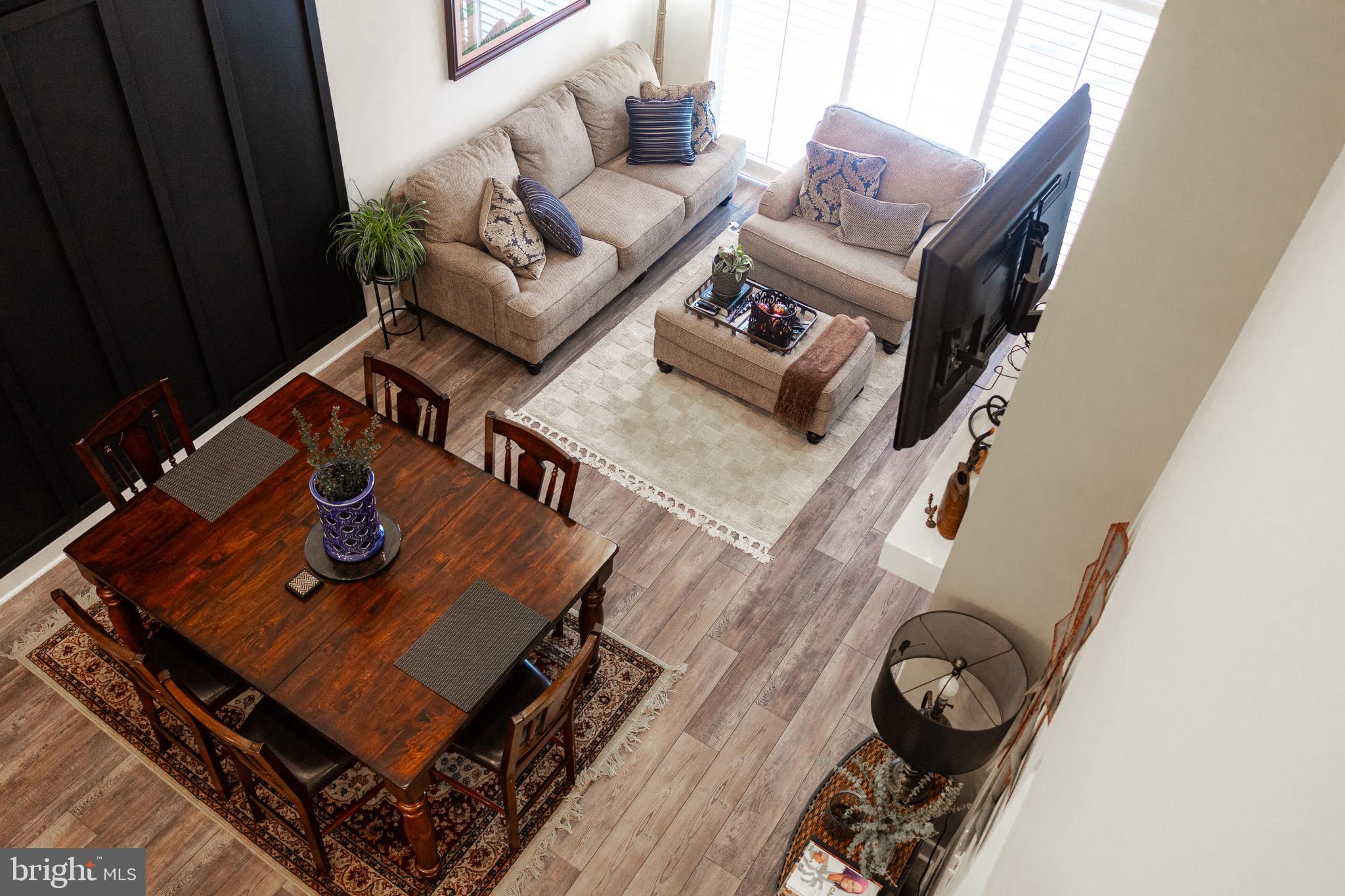 12207 American Chestnut Road Bowie, MD 20720 - Photo 9 of 19 a living room with furniture and wooden floor