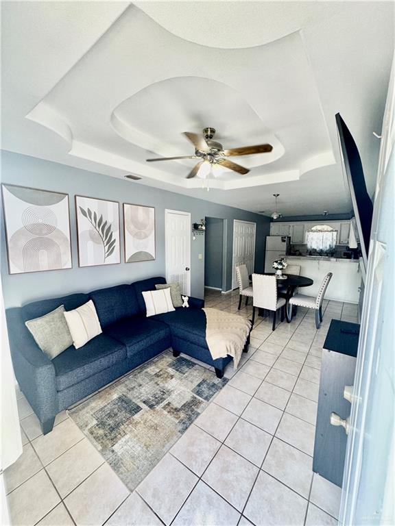 303 South Avasolo Street Rio Grande City, TX 78582 - Photo 2 of 5 a living room with furniture and a rug