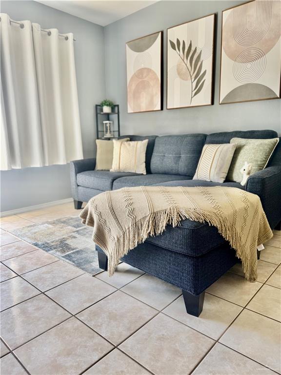 303 South Avasolo Street Rio Grande City, TX 78582 - Photo 3 of 5 a bedroom with a bed and a painting on the wall