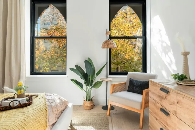 a bedroom with a bed and window