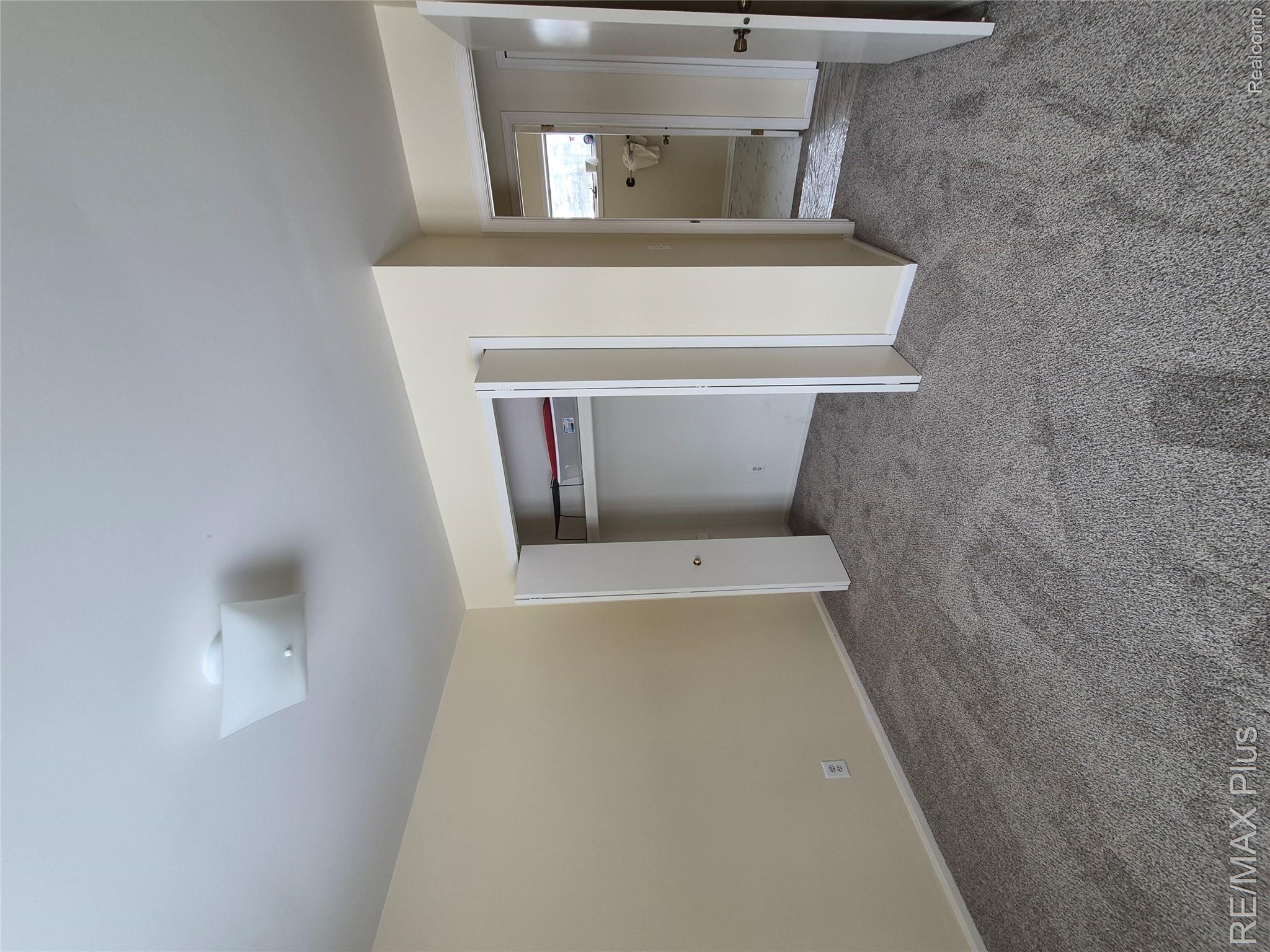 1115 Turrill Road Lapeer, MI 48446 - Photo 20 of 50 Unfurnished bedroom with light carpet and a closet