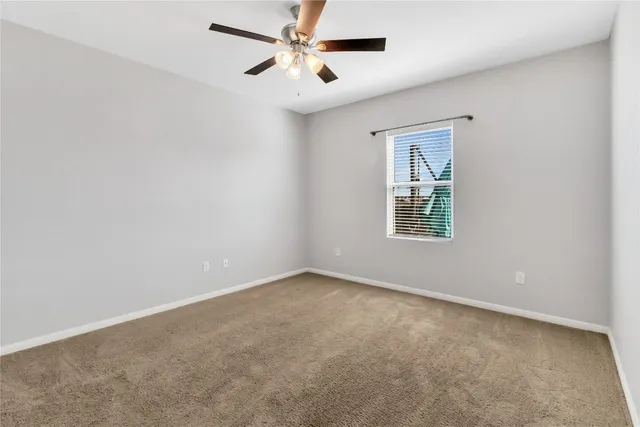 a kitchen with stainless steel appliances granite countertop a stove refrigerator sink and microwave