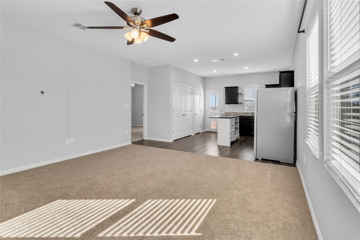 105 Bell Rings Drive Jarrell, TX 76537 - Photo 4 of 22 a view of a kitchen with a sink and a refrigerator