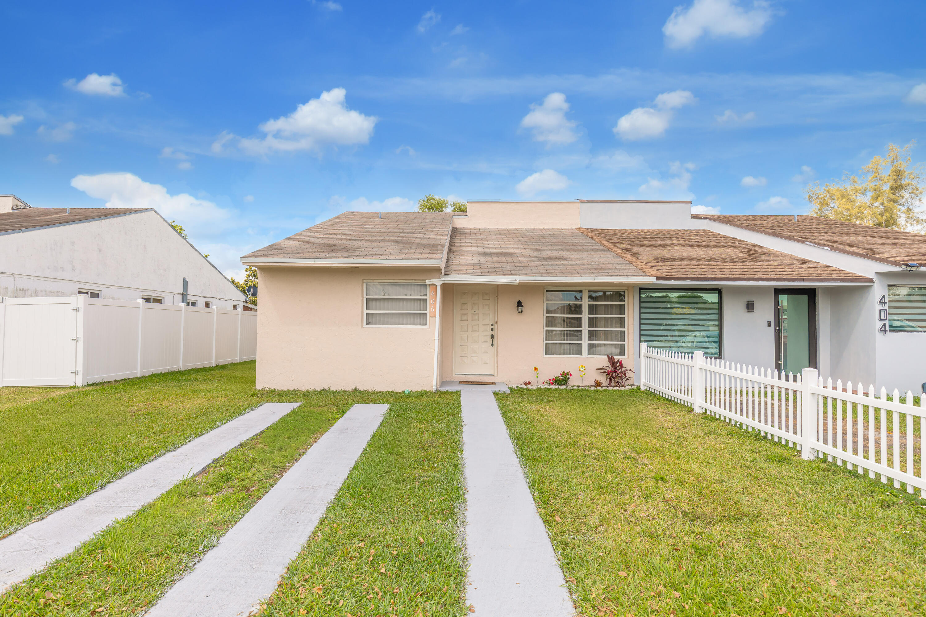 406 Southwest 96th Court, Unit 2 Miami, FL 33174 - Photo 1 of 38 a front view of a house with a yard