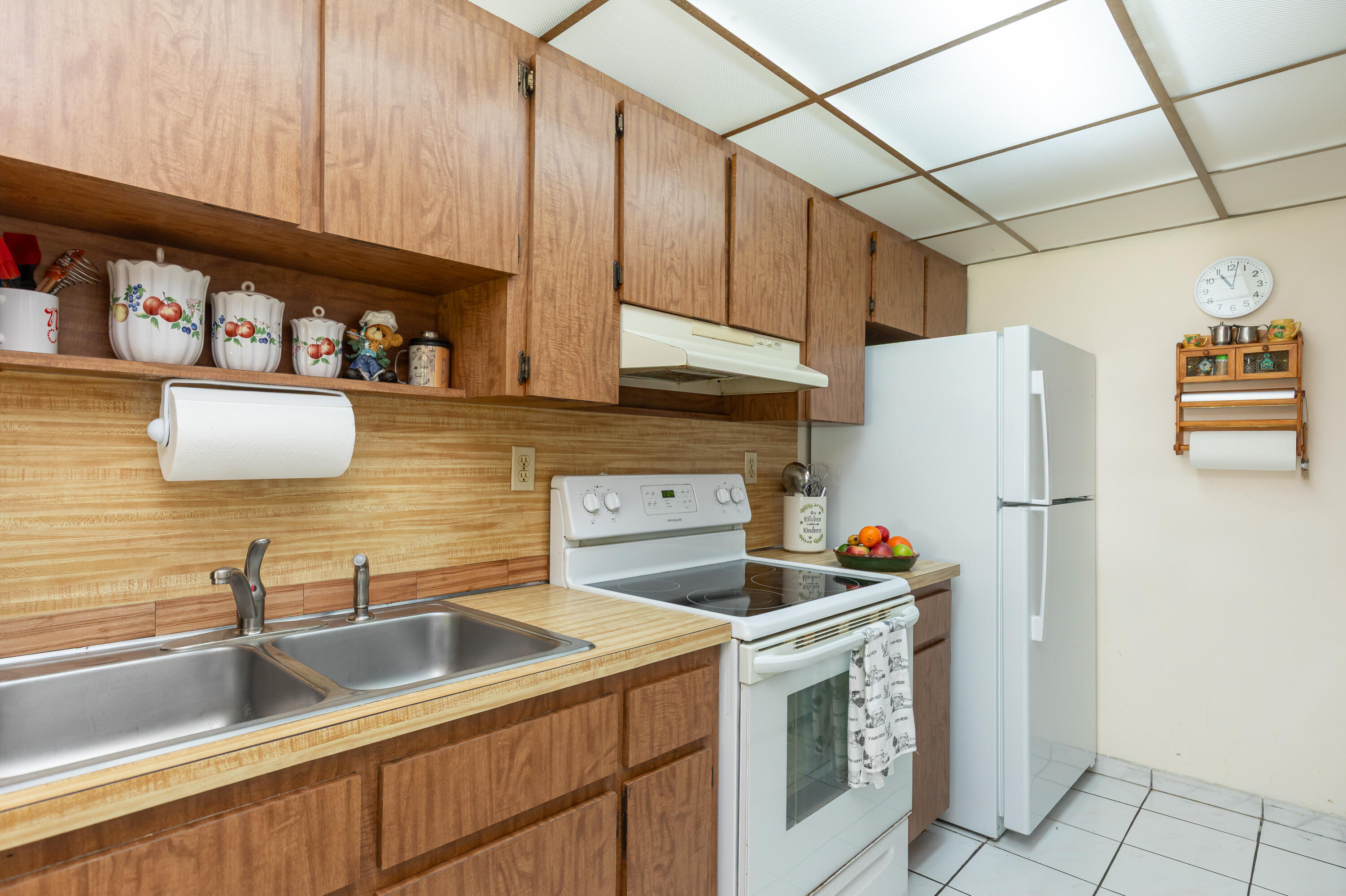 406 Southwest 96th Court, Unit 2 Miami, FL 33174 - Photo 12 of 38 a kitchen with stainless steel appliances a sink a refrigerator and cabinets