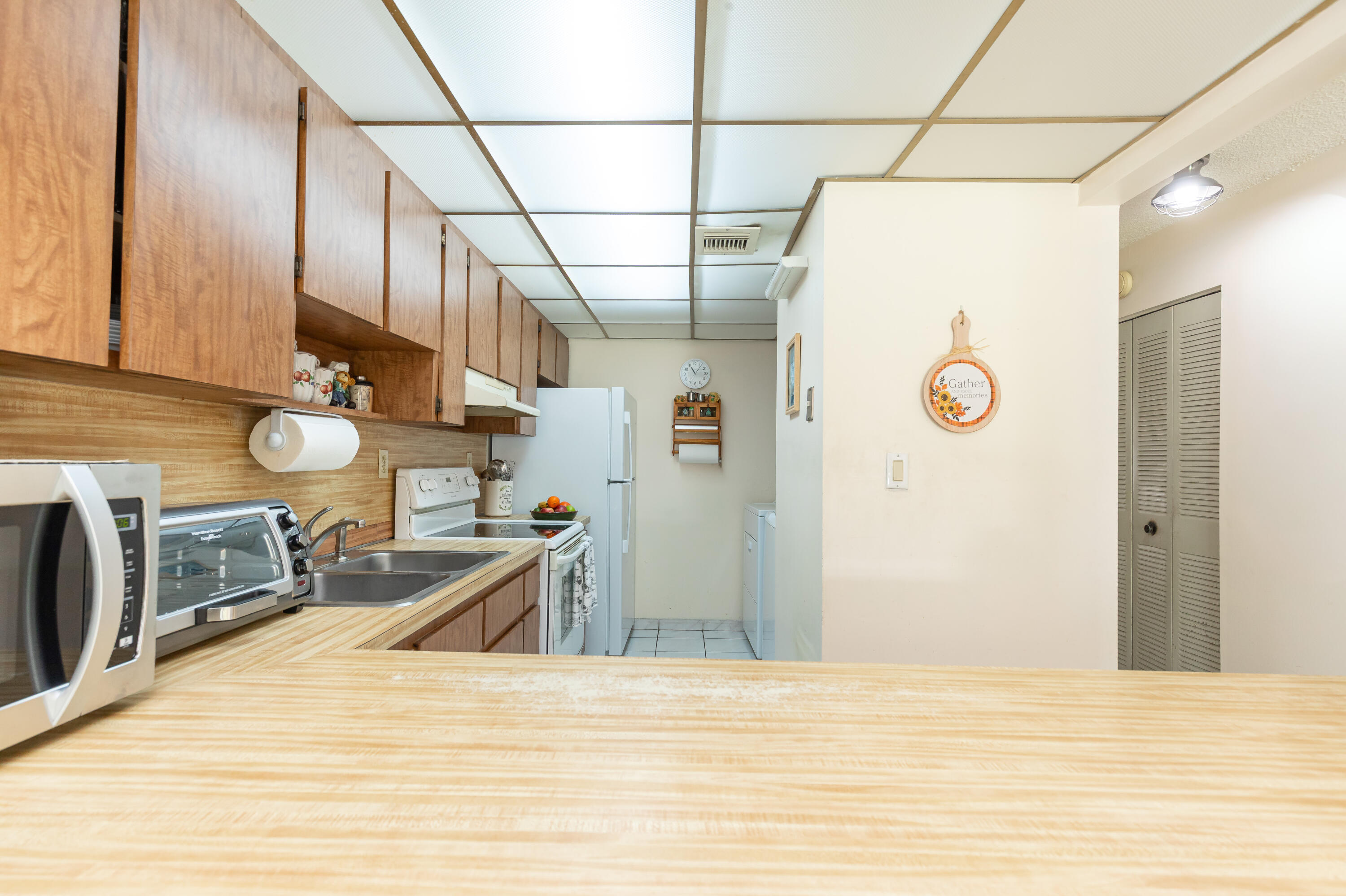 406 Southwest 96th Court, Unit 2 Miami, FL 33174 - Photo 17 of 38 a view of a refrigerator in kitchen and a sink