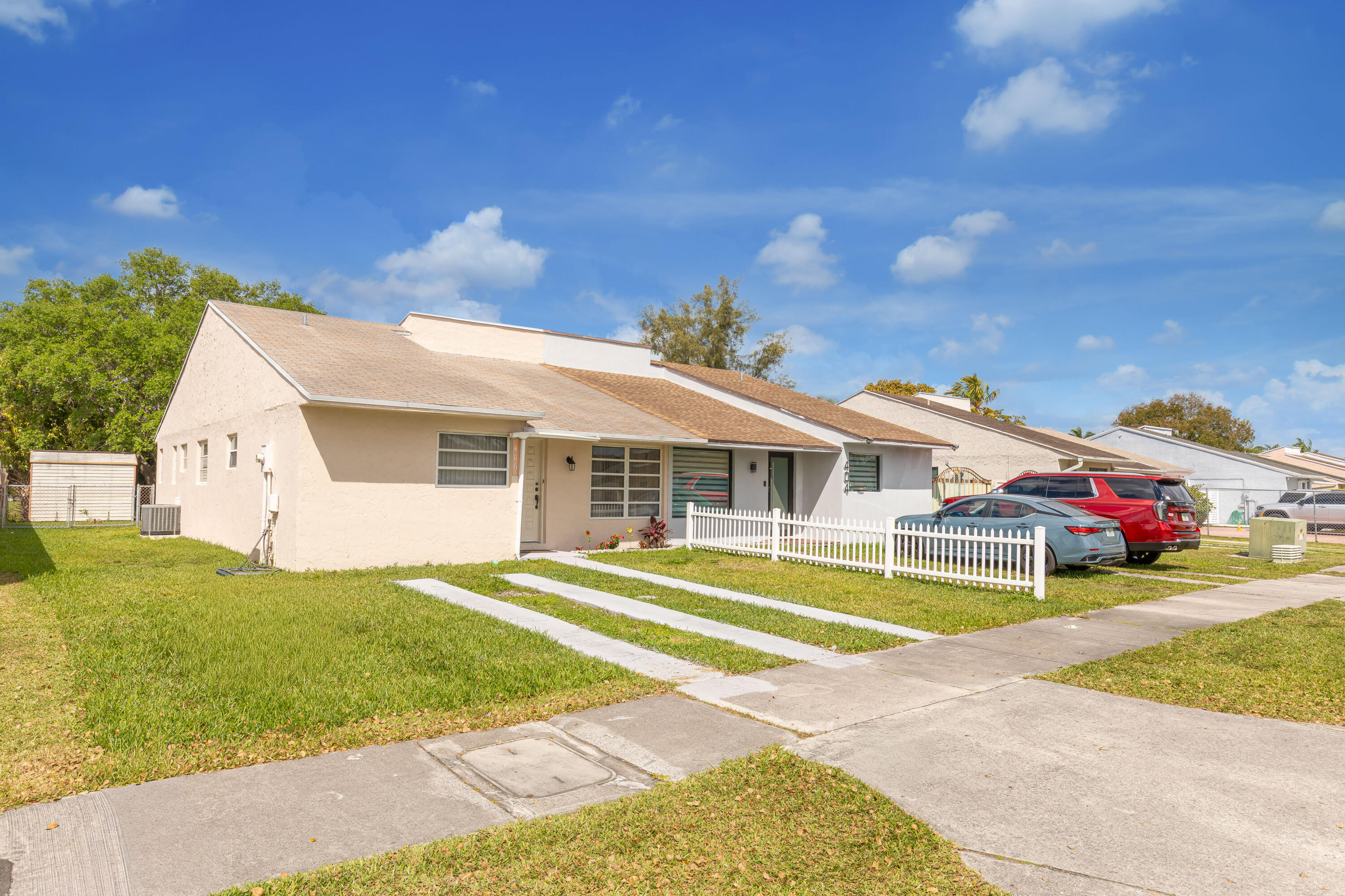 406 Southwest 96th Court, Unit 2 Miami, FL 33174 - Photo 2 of 38 a view of a house with swimming pool and a yard