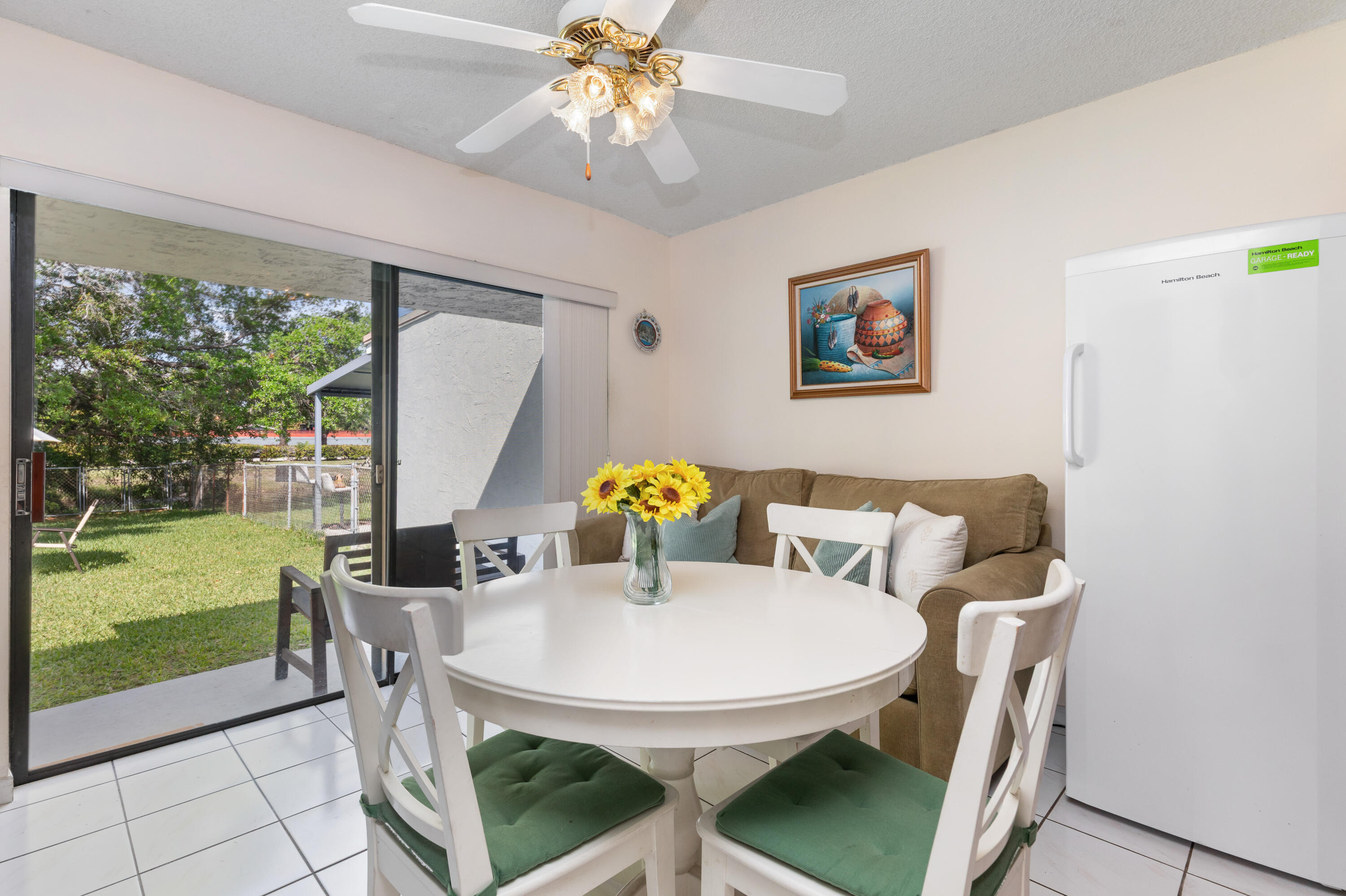 406 Southwest 96th Court, Unit 2 Miami, FL 33174 - Photo 22 of 38 a view of a dining room with furniture window and outside view
