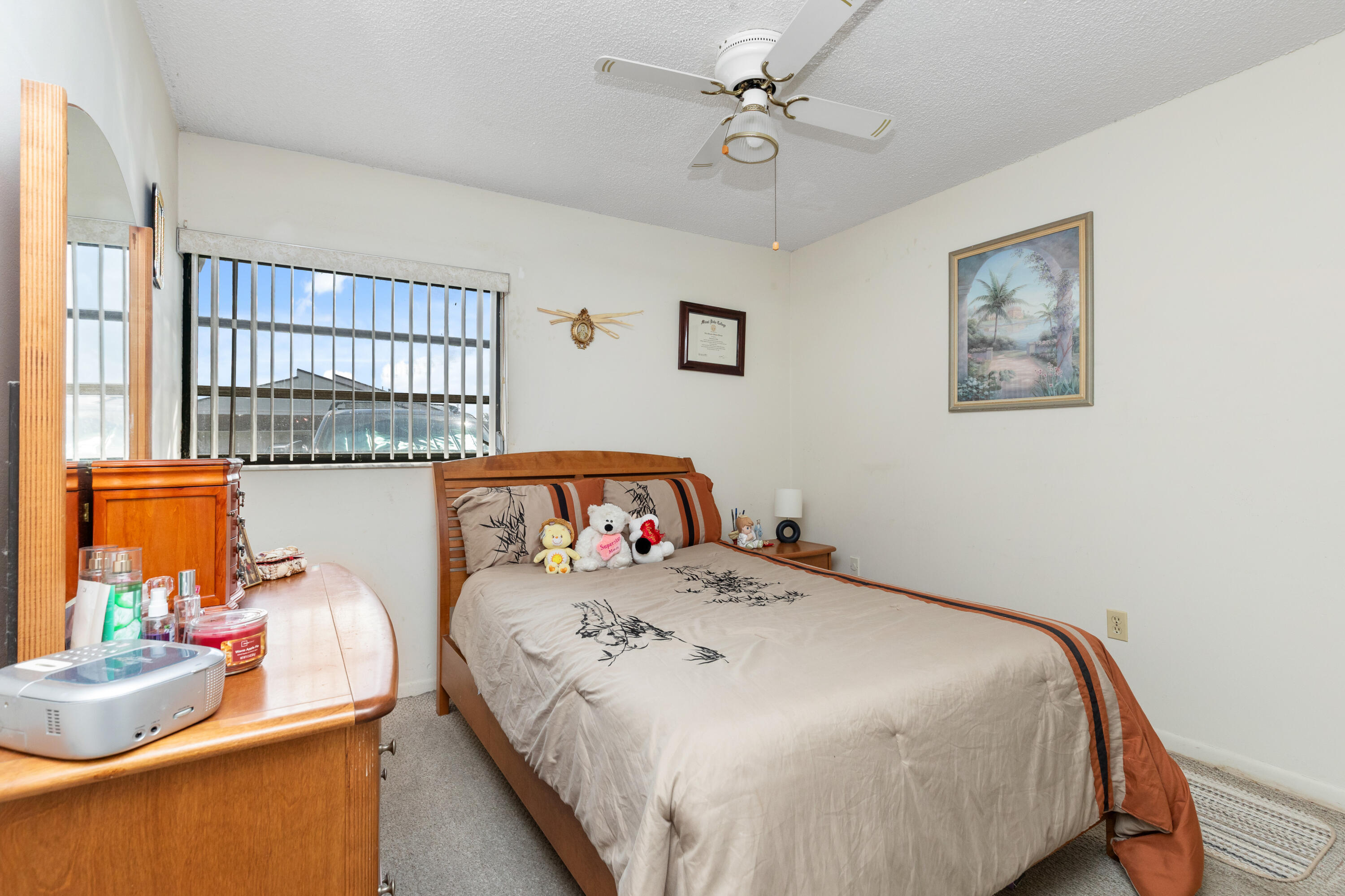 406 Southwest 96th Court, Unit 2 Miami, FL 33174 - Photo 26 of 38 a bedroom with a bed and wooden floor