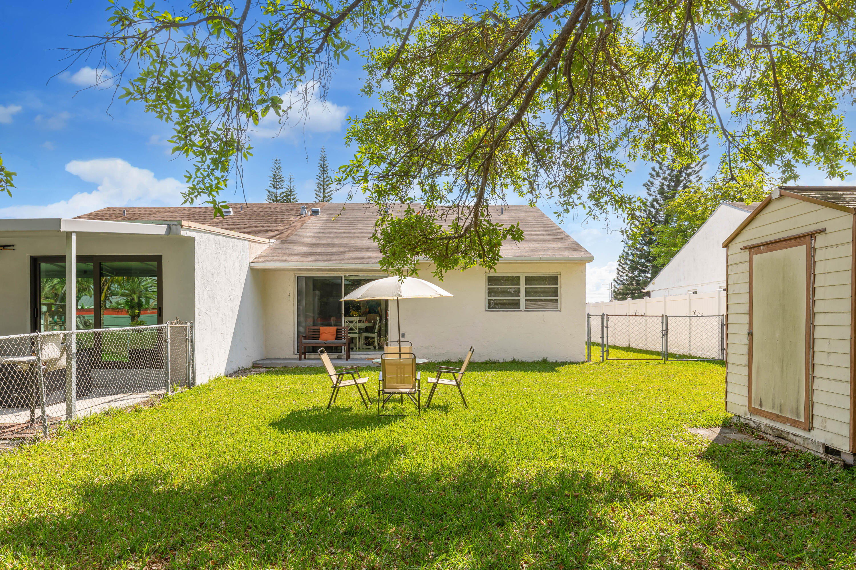 406 Southwest 96th Court, Unit 2 Miami, FL 33174 - Photo 36 of 38 a view of a house with a yard patio and swimming pool