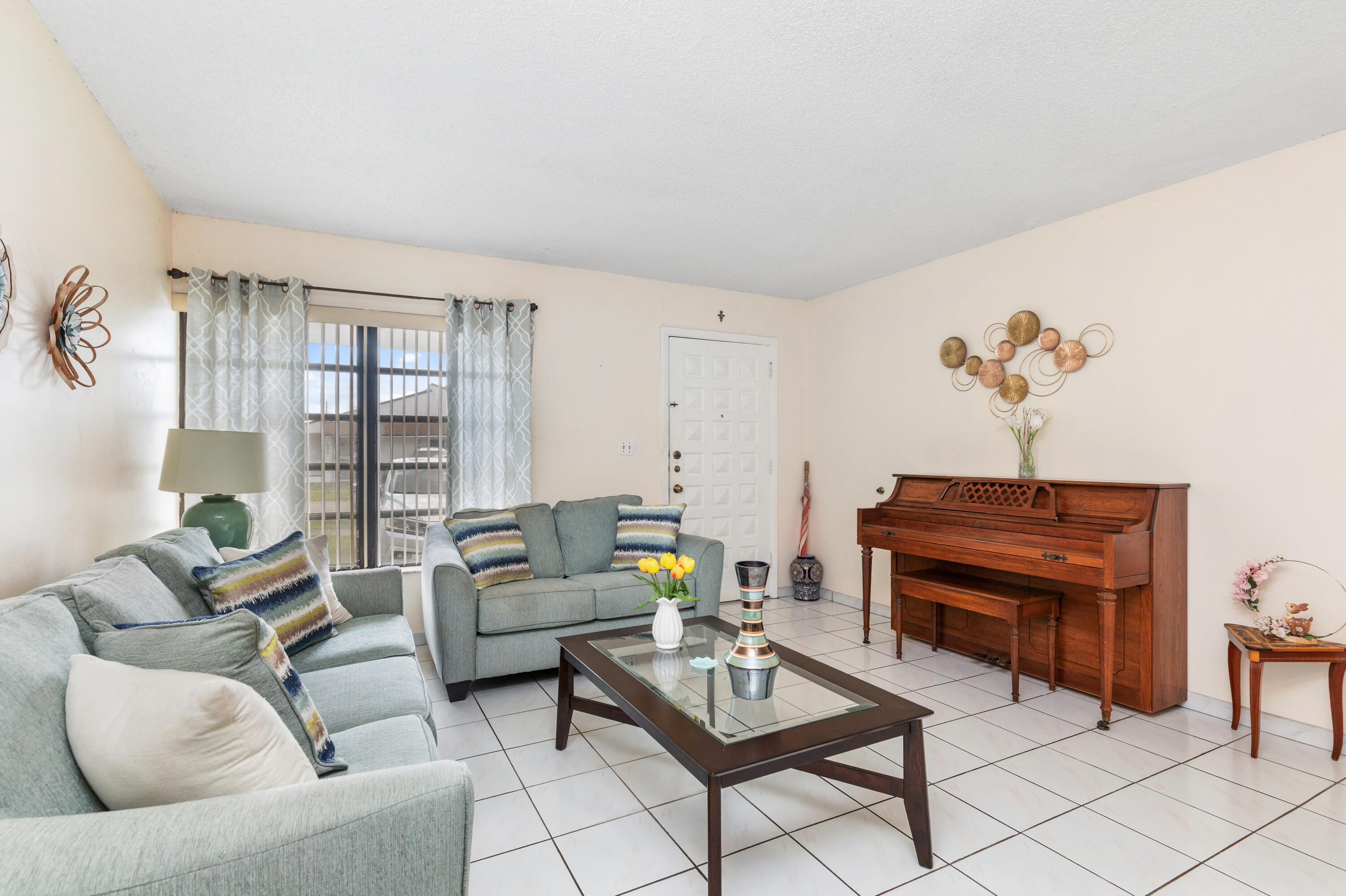 406 Southwest 96th Court, Unit 2 Miami, FL 33174 - Photo 5 of 38 a living room with furniture and a piano