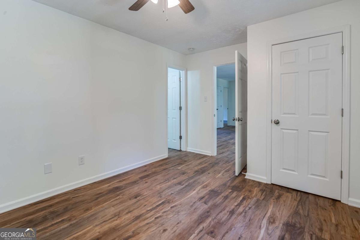 325 Camp Ground Road Griffin, GA 30223 - Photo 11 of 25 a view of an empty room with wooden floor