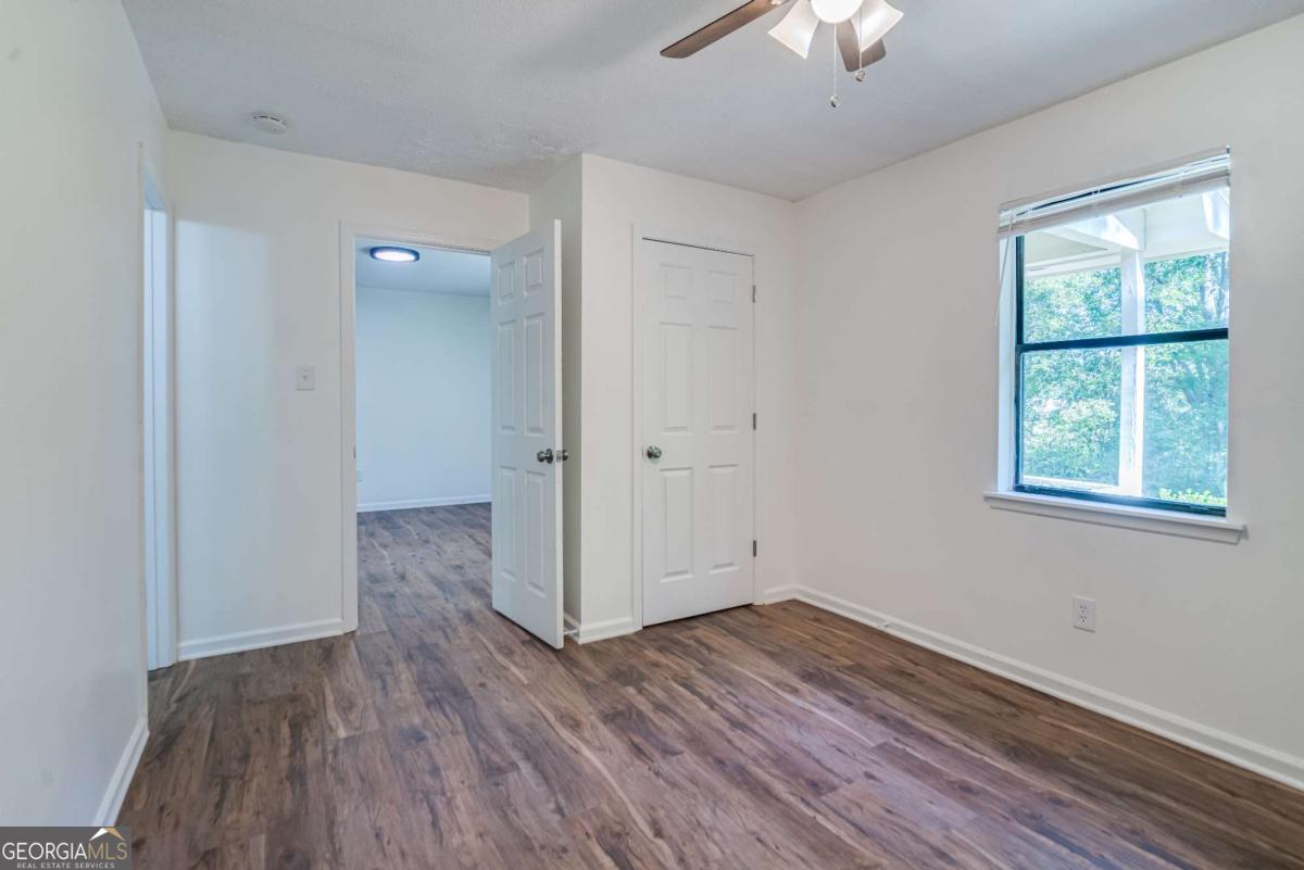 325 Camp Ground Road Griffin, GA 30223 - Photo 12 of 25 wooden floor in an empty room with a window