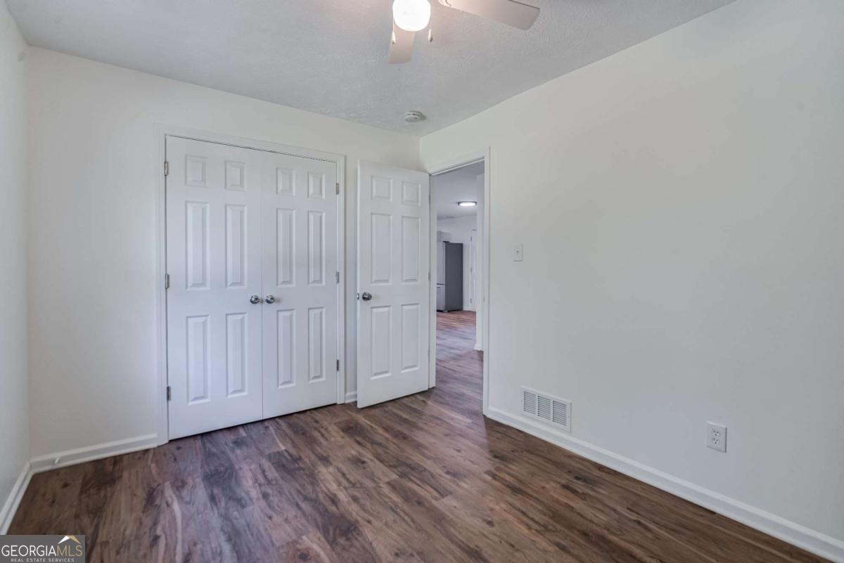 325 Camp Ground Road Griffin, GA 30223 - Photo 19 of 25 wooden floor in an empty room