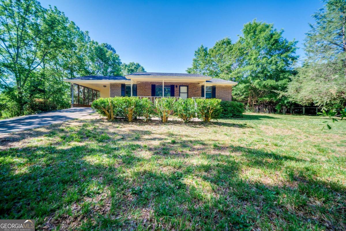 325 Camp Ground Road Griffin, GA 30223 - Photo 2 of 25 a front view of a house with a yard