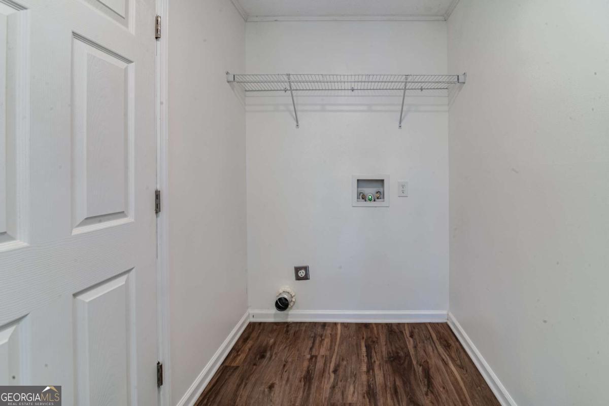 325 Camp Ground Road Griffin, GA 30223 - Photo 21 of 25 a view of a room with wooden floor and small window