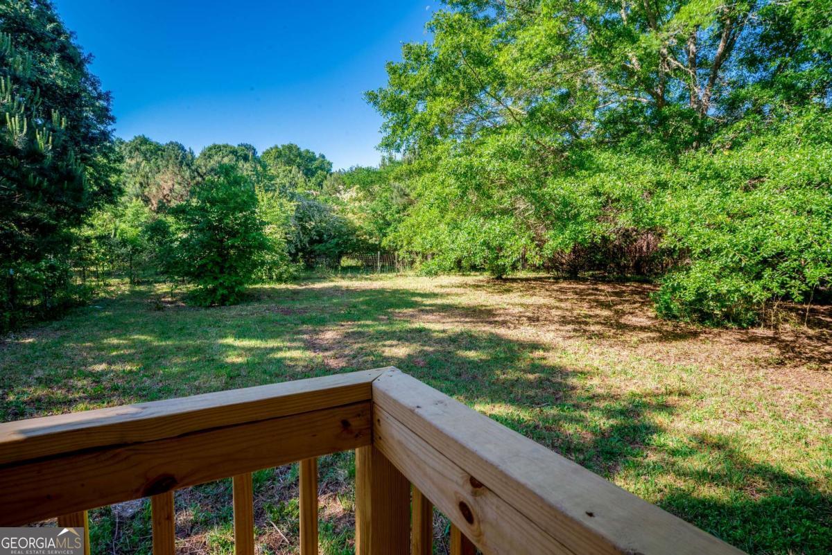325 Camp Ground Road Griffin, GA 30223 - Photo 22 of 25 a view of a yard with wooden fence