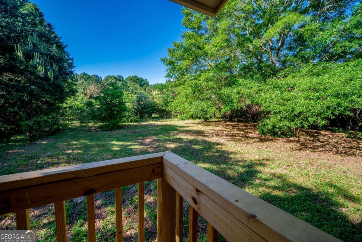 325 Camp Ground Road Griffin, GA 30223 - Photo 23 of 25 a view of a wooden deck with a yard