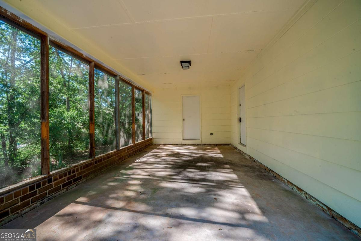 325 Camp Ground Road Griffin, GA 30223 - Photo 24 of 25 a view of a room with large windows and trees