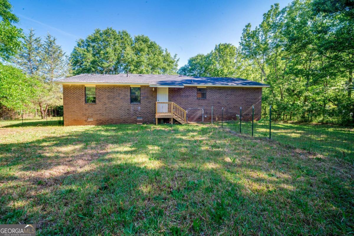 325 Camp Ground Road Griffin, GA 30223 - Photo 25 of 25 a view of a house with a yard