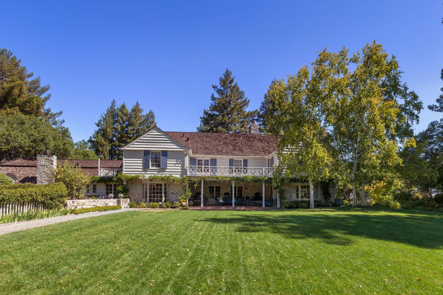 176 Harcross Road Woodside, CA 94061 - Photo 4 of 13 a front view of a house with a garden