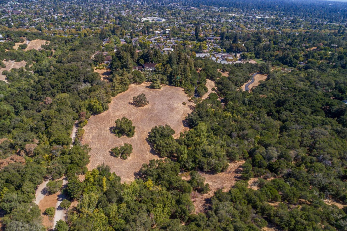 176 Harcross Road Woodside, CA 94061 - Photo 8 of 13 an aerial view of a house with a yard and trees