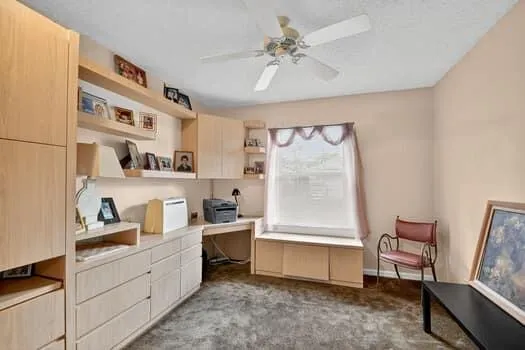 a room with furniture a air conditioner and a window