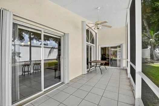a view of a hallway with dining area and glass door