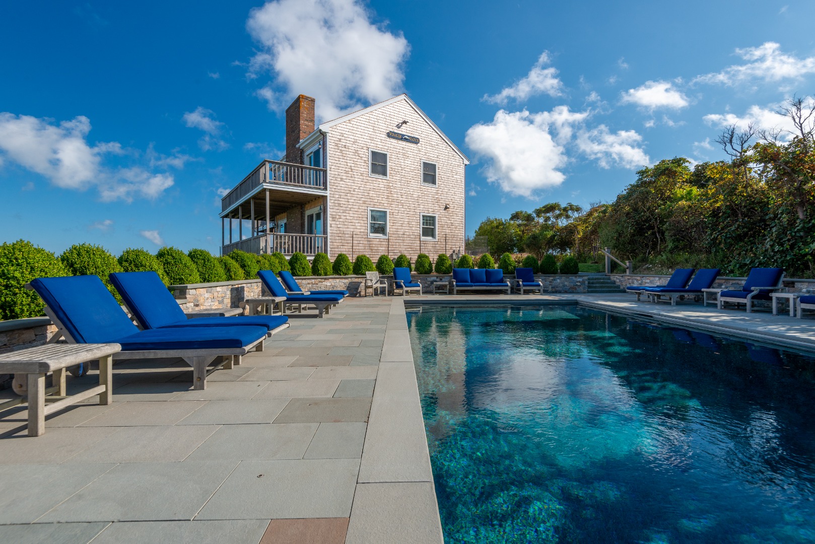 1 Reeds Way Nantucket, MA 02554 - Photo 6 of 51 a view of a lake with a chairs and table on the terrace