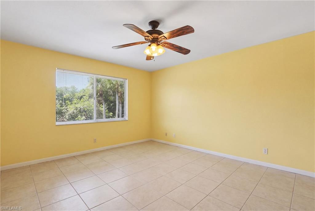 4050 Ice Castle Way, Unit 2812 Naples, FL 34112 - Photo 26 of 49 Spacious room featuring neutral tile flooring and a ceiling fan with integrated lighting
