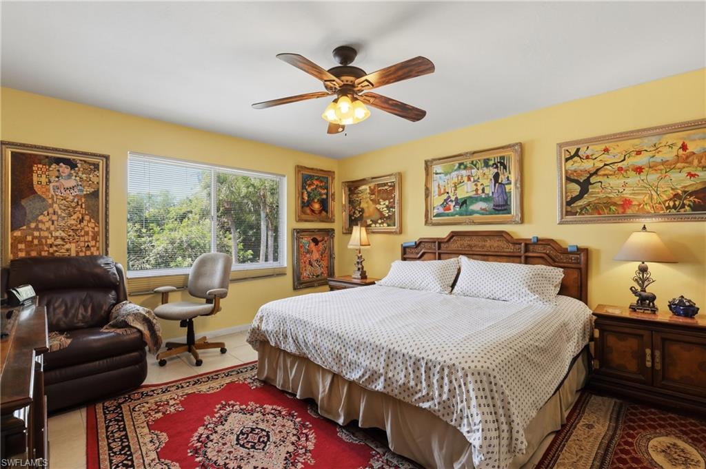 4050 Ice Castle Way, Unit 2812 Naples, FL 34112 - Photo 27 of 49 Spacious room featuring a multi-pane window, tile flooring, and a ceiling fan with integrated lighting