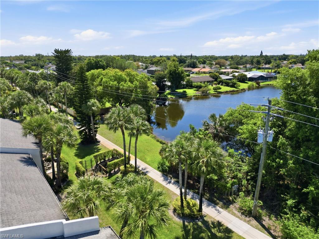 4050 Ice Castle Way, Unit 2812 Naples, FL 34112 - Photo 46 of 49 Expansive water frontage with mature trees and lush green landscaping