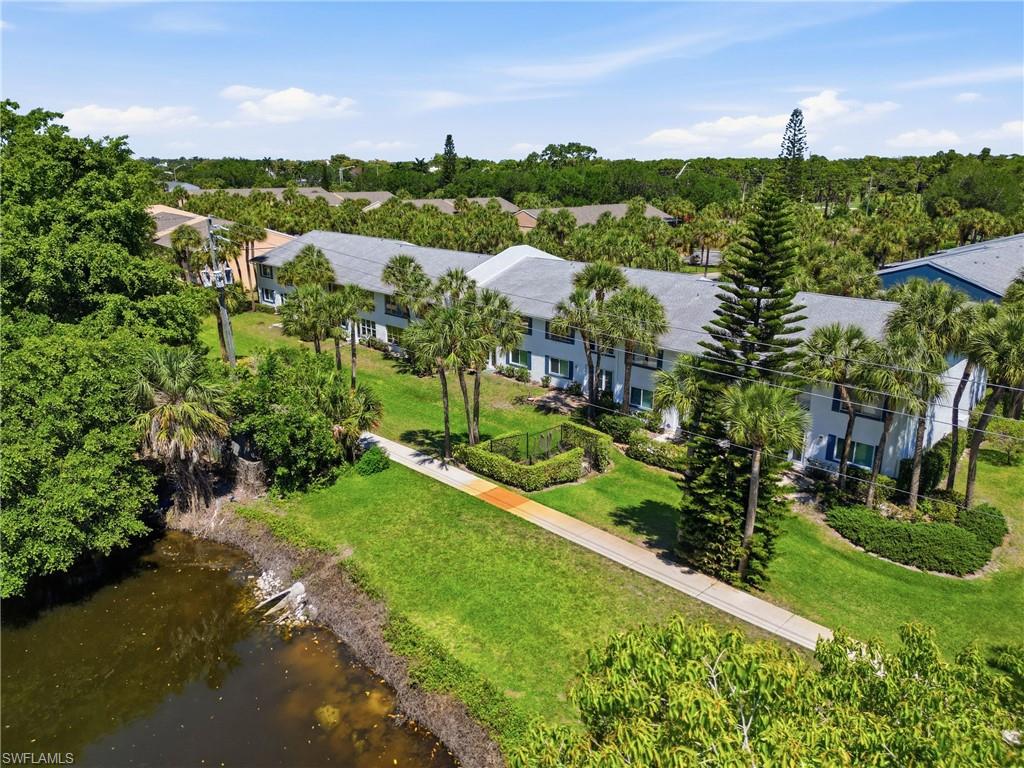 4050 Ice Castle Way, Unit 2812 Naples, FL 34112 - Photo 47 of 49 Two-story multi-unit property featuring light blue siding and a gray shingle roof