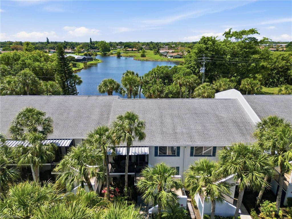 4050 Ice Castle Way, Unit 2812 Naples, FL 34112 - Photo 49 of 49 Multi-level residential structure featuring a gray shingle roof and white exterior siding