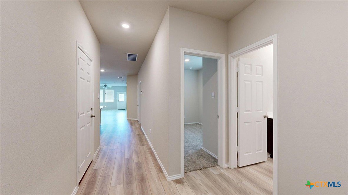 1111 Stone Vly Road Temple, TX 76502 - Photo 21 of 21 a view of a hallway with wooden floor