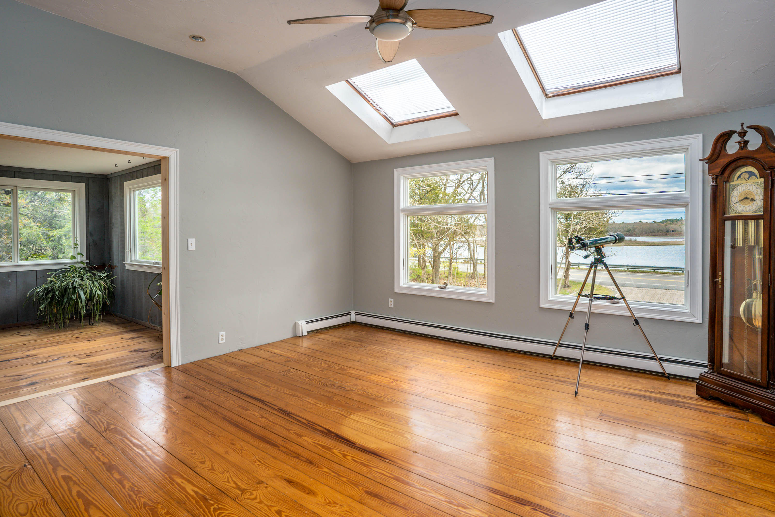 268 Shore Road Buzzards Bay, MA 02532 - Photo 7 of 36 wooden floor in an empty room with a window