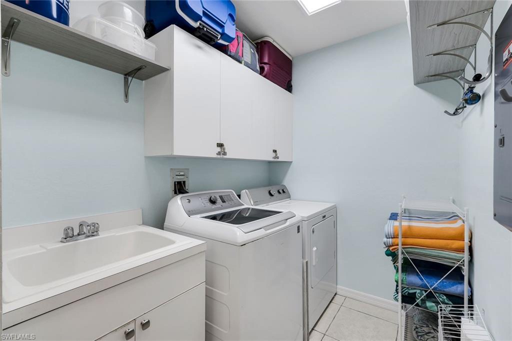 460 Launch Circle, Unit 202 Naples, FL 34108 - Photo 22 of 34 a utility room with dryer and washer