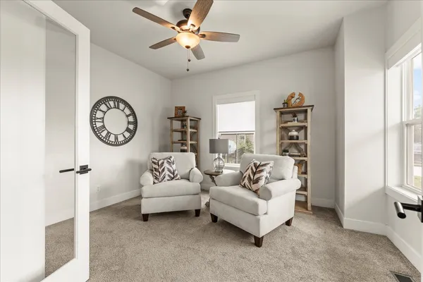a living room with furniture and a large window